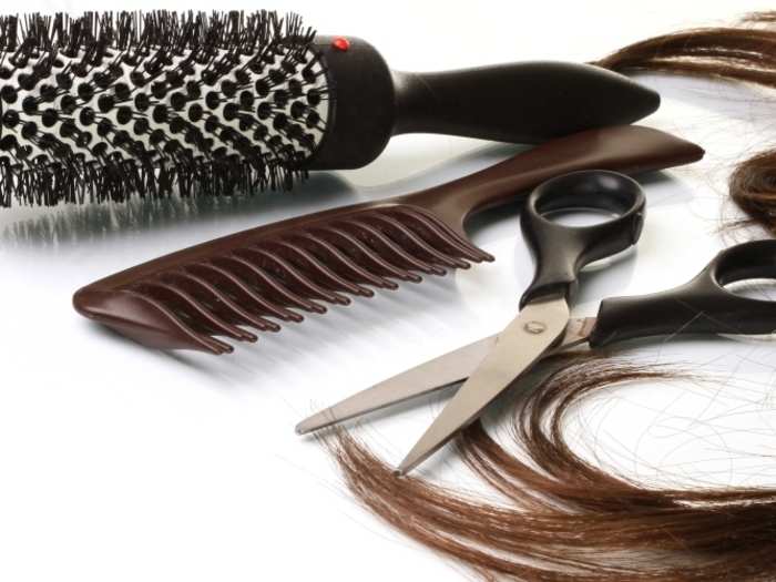 Hairstyling products including a blowdryer and flatiron by Tools By Gina, $250