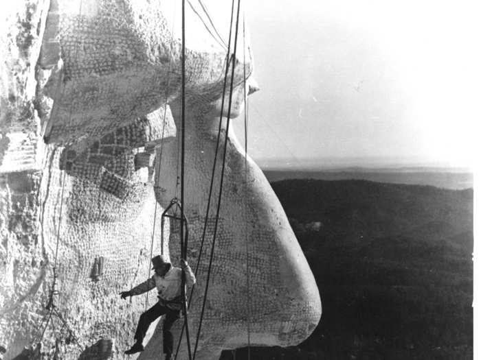 Throughout the process, Gutzon Borglum, the sculptor responsible for the overall vision of Mount Rushmore, supervised workers and checked their progress.