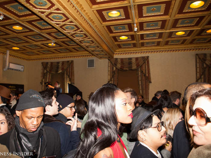 Socialites filed into the packed lobby to grab a drink before start time.