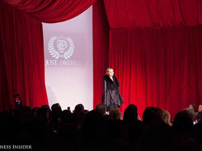 Actress Abigail Breslin opened the show in an all-black, fur-collared wrap jacket.