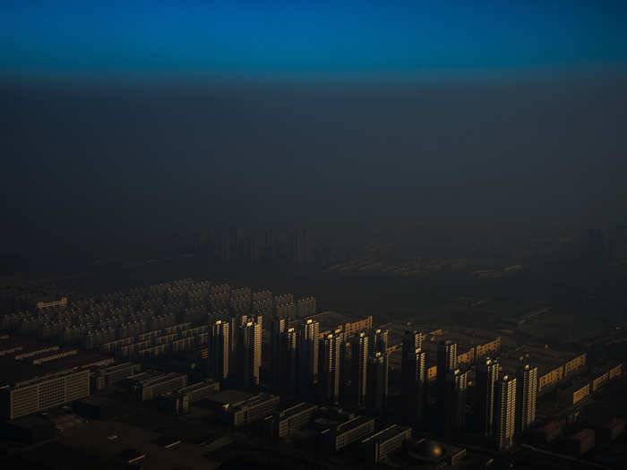 Contemporary Issues Singles, 1st prize: Zhang Lei, China — A city in northern China shrouded in haze, Tianjin, China, 10 December 2015.