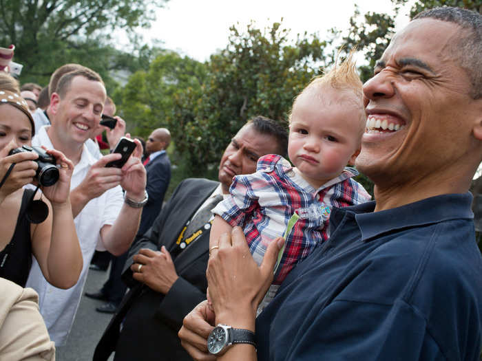 The president is more amused than his young mohawked friend.