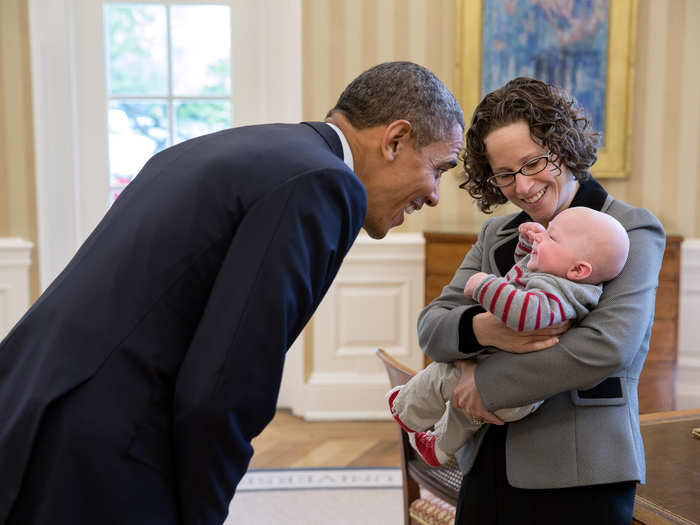 This baby gives Obama a fist bump of his own.