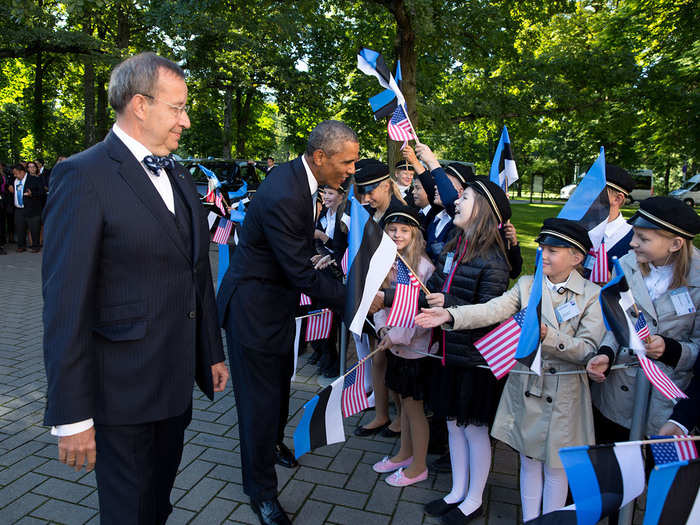 The president greeting some Estonian schoolgirls.