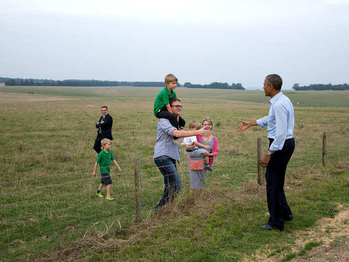 The POTUS casually greets a family at Stonehenge.