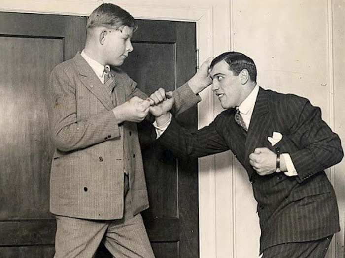 At age 12, Wadlow learned he had a hyperactive pituitary gland that caused his incredible growth. In this photo, world heavyweight champion Primo Carnera playfully punches a then 6-foot-11 Wadlow.