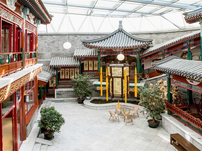 CHINA: This traditional-style Beijing home is going for $91 million. The five-bedroom place includes a covered, sunken courtyard, around which the rest of the house is arranged.