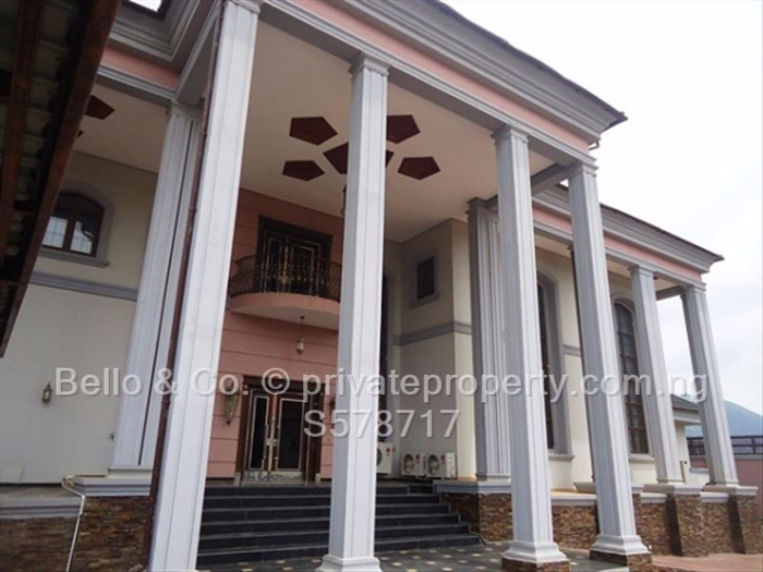 NIGERIA: This four-bedroom "ambassadorial mansion" in Abuja will run you $12.5 million. The house is done up in an opulent style, with marble floors, a sweeping double staircase in the entrance, and double-height ceilings and windows bedecked in long curtains.