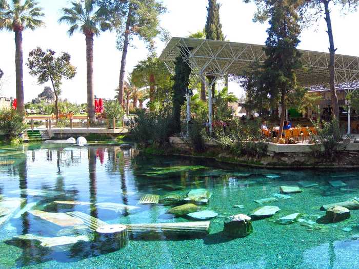 The Sacred Pool in Pamukkale, Turkey, has submerged pieces of original marble columns from the ancient Roman city of Hierapolis. The water is said to be rich in minerals that provide natural restorative powers.