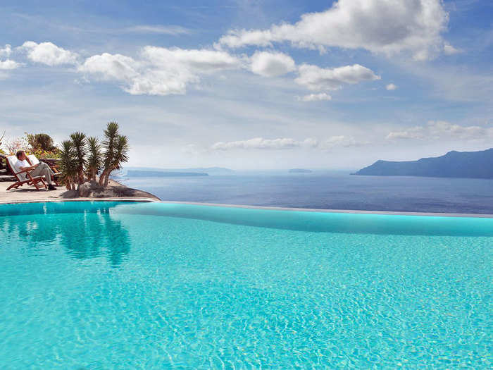 The Perivolas Hotel in Greece has the one of the most beautiful infinity pools, with blue water that seems to spill out right into the Mediterranean.