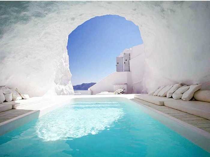 The cave pool at the Katikies Hotel in Santorini, Greece, offers a breathtaking Mediterranean hideaway.