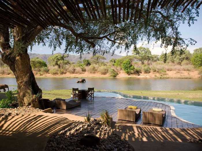 At the Chongwe River House in Zambia, you can relax at the pool while watching animals come to bathe and drink in the nearby Chongwe River.