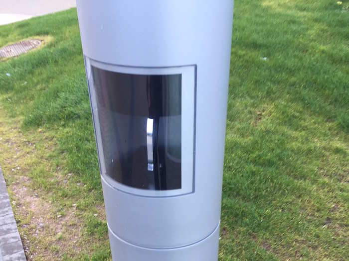 This lamp post on the Hollyhill campus had a strange glass window with something metal on the inside. It could have just been a switch, but it could also be something more exciting.