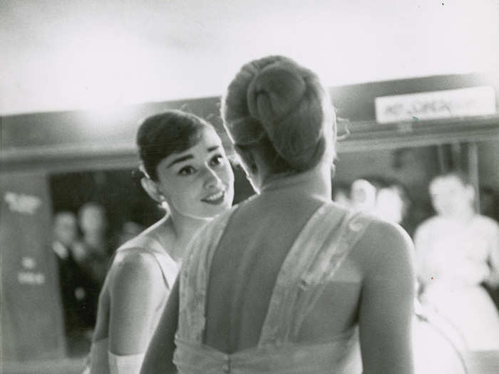 Presenters Audrey Hepburn and Grace Kelly wait backstage during the 28th Annual Academy Awards.