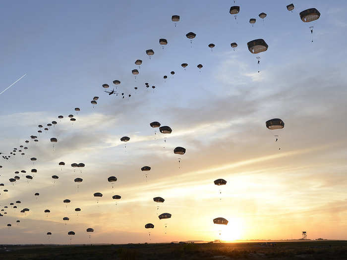 US Army and British paratroopers perform a static line jump at Holland Drop Zone in preparation for Combined Joint Operational Access Exercise 15-01 at Fort Bragg, North Carolina.