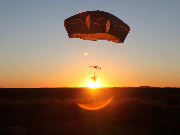 A US Army paratrooper, assigned to 1st Brigade Combat Team, 82nd Airborne Division, conducts airborne operations at Fort Hood, Texas.