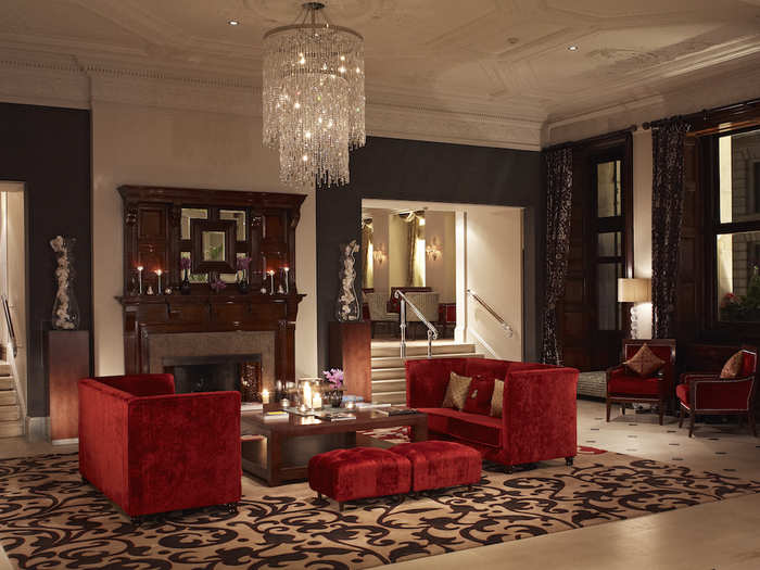 Guests are greeted in an extravagant lobby with warm, homely features such as a fireplace as well as glitzy chandeliers.
