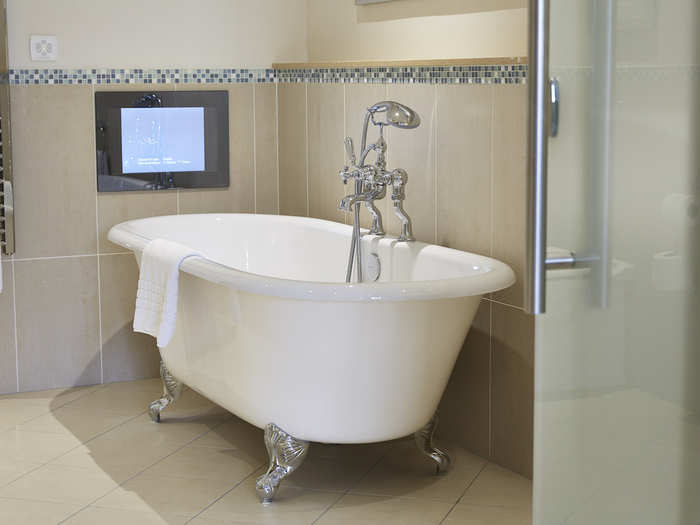 In the Waterloo Suite bathroom, you can watch TV as you take a relaxing bath.