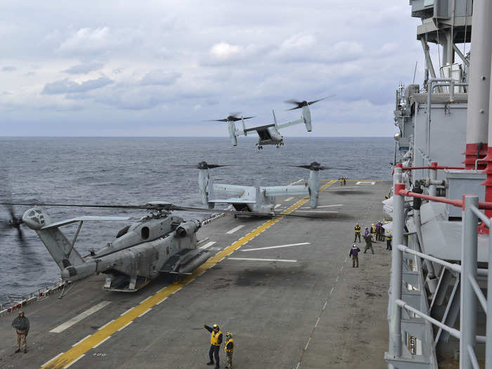 An MV-22 Osprey tiltrotor aircraft assigned to Marine Medium Tiltrotor Squadron takes off from the flight deck of the amphibious assault ship USS Bonhomme Richard.