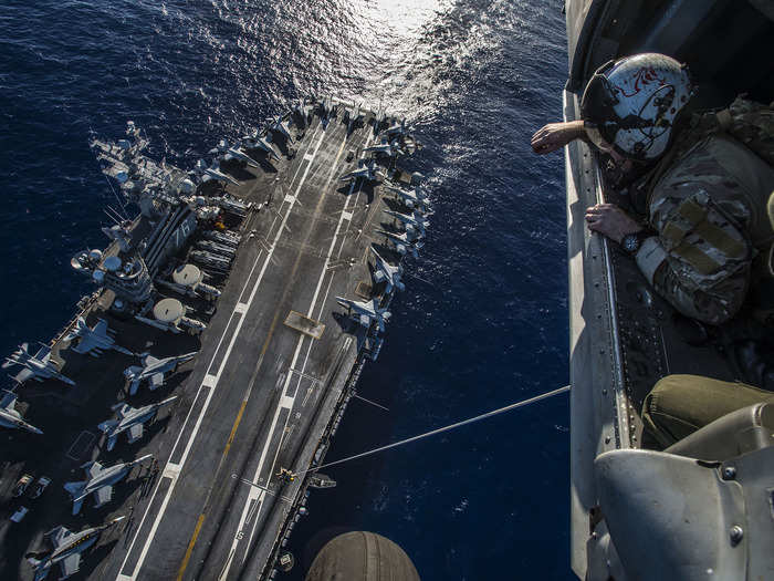 Sailors conduct a special patrol insertion/extraction exercise aboard the aircraft carrier USS Ronald Reagan.