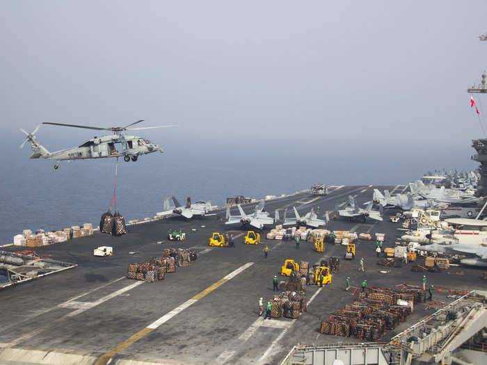 USS Theodore Roosevelt conducts a replenishment.