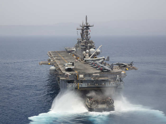 A landing craft air cushion enters the well deck of USS Kearsarge in Gulf of Aden.