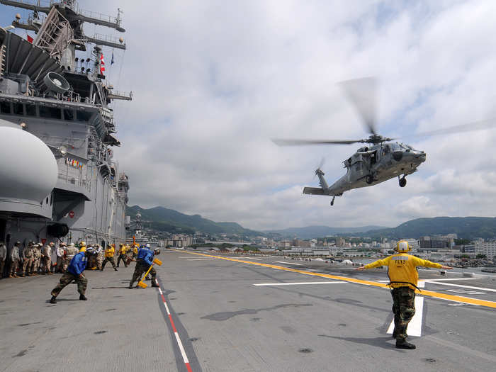 MH-60S Sea Hawk helicopter lands aboard USS Essex.