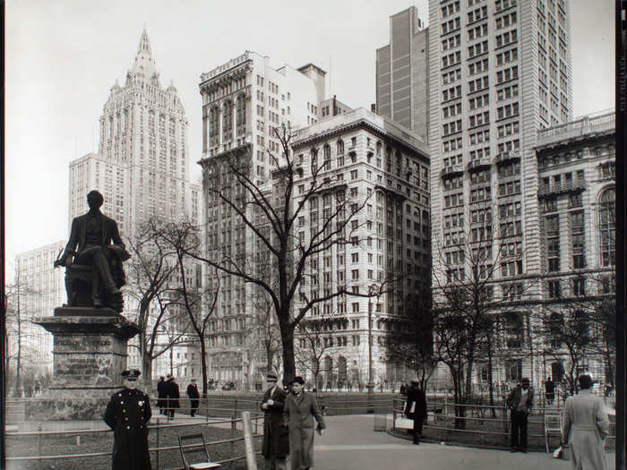 In the 1930s, Madison Square Park was a place for people to walk around and enjoy views of the buildings surrounding it.