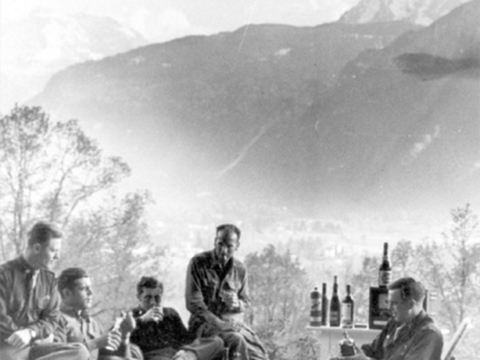 Maj. Dick Winters, Lewis Nixon, Harry Welsh, and two other battalion staff members, celebrate VE-Day in Berchtesgaden, Germany.