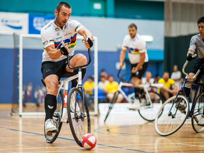 Cycleball is a competition between two teams of two, played on bicycles with no breaks. Their goal is to get the ball into the goal using only their wheels and their heads. Players are allowed to use their hands on defense, but not on offense.
