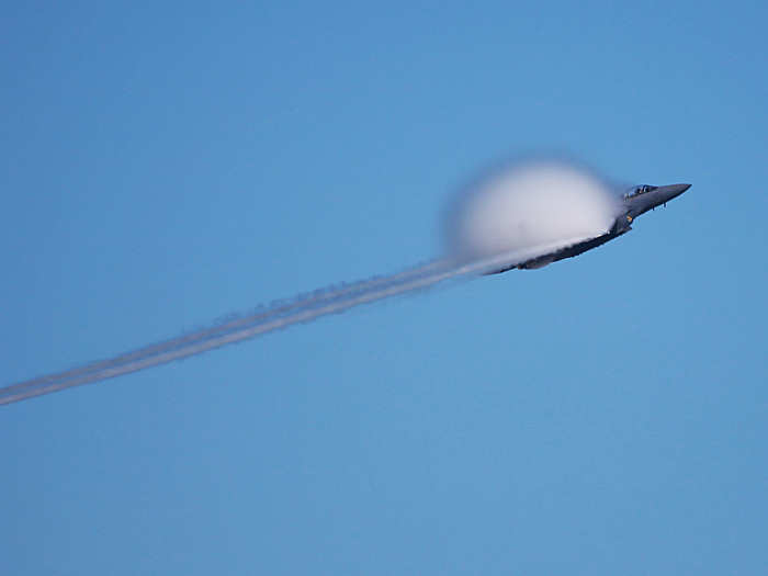 An Air Force F/A-15 Strike Eagle reaches the sound barrier during the San Francisco Fleet Week Air Show.