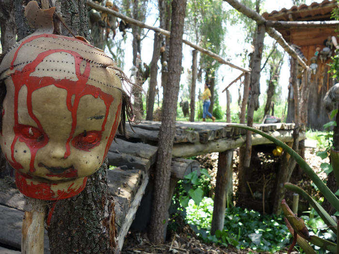 He hung the dolls as he found them, regardless of damage or mutilations that afflicted the dolls.