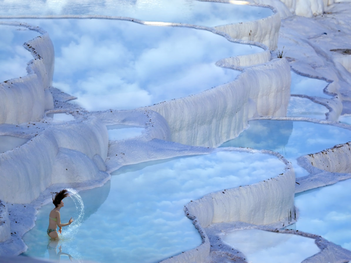 In the province of Denizli in western Turkey, the naturally terraced thermal springs of Hierapolis-Pamukkale date as far back as the second century B.C. Formed by calcite in the water, the hot springs look like stunning white clouds.