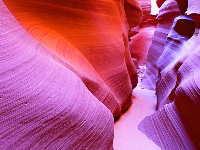 Antelope Canyon, located near Page, Arizona, is the most photographed canyon in the American Southwest. Travelers flock here to capture its masterpiece of colors while admiring its smooth, wave-like texture.