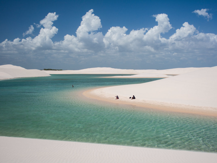 At first glance, the Lencois Maranhenses Sand Dunes of northeastern Brazil look like your average set of sand dunes, but the valleys are filled with water since the low-lying lands often flood during the wet season. Fish even live in the pools.