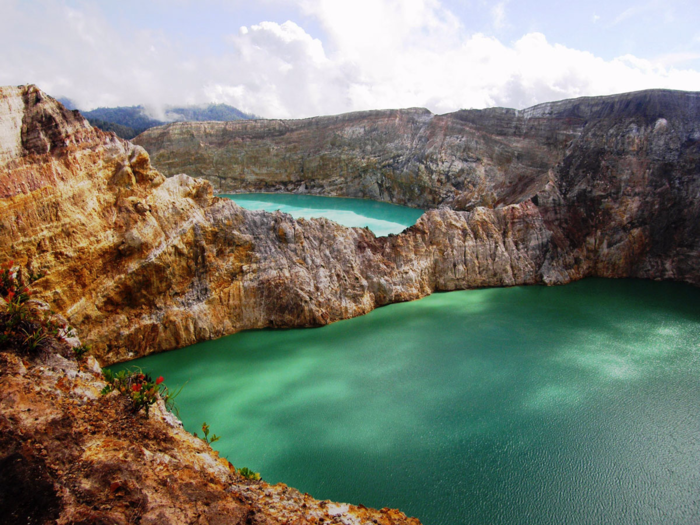 The Kelimutu volcano on Flores island, Indonesia, is home to three colored lakes ranging from turquoise to a rich green. The lakes are incredibly dense, adding to the striking appearance of their colors, which are thought to be caused by dissolving minerals.