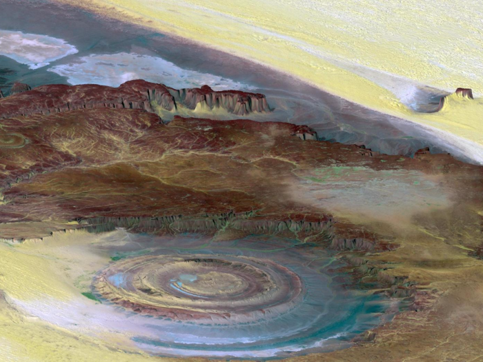 The Richat Structure, also known as the Eye of the Sahara, stands as a large bullseye in the middle of the Sahara Desert. With a diameter that spans almost 30 miles, it is thought to be the result of erosion and stands as a marvel for scientists and travelers alike.