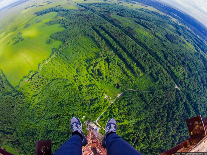 Part of the fun is discovering and exploring abandoned structures, like this radio tower in Russia. This perspective took a staggering 1,148-foot climb to reach, but was worth it for the lush scenery they saw below.