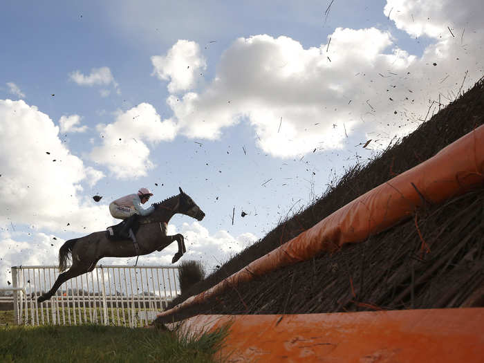 Harry Skelton riding Artifice Sivola in action at Newbury racecourse on March 04, 2016, in Newbury, England.