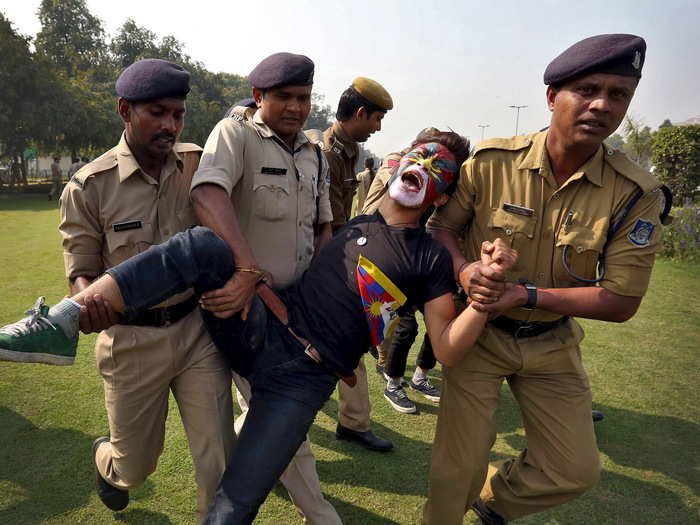 Indian police detain a Tibetan activist during a protest held to mark the 57th anniversary of the Tibetan uprising against Chinese rule, outside the Chinese embassy in New Delhi, India, on March 10.