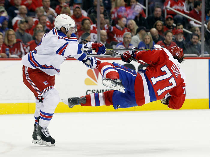 Eric Staal, No. 12 of the New York Rangers, checks T.J. Oshie, No. 77 of the Washington Capitals, during the second period at the Verizon Center on March 4, 2016, in Washington, DC.