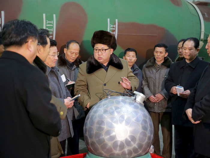 North Korean leader Kim Jong Un meets nuclear-weapons scientists and technicians in this undated photo released by North Korea