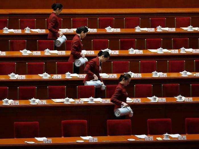 Attendants prepare tea inside the Great Hall of the People ahead of the second plenary session of the National People