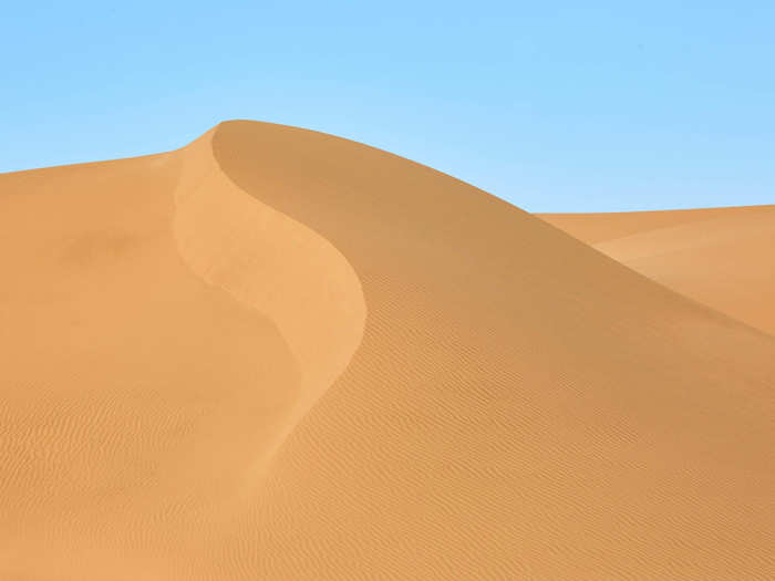 The dunes look unrealistically smooth and completely untouched.