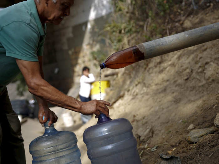 People in Caracas, Venezuela get their water from a spring next to the Avila mountain.