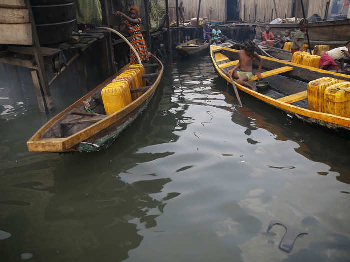 People in the Lagos Lagoon, Nigeria are getting their water from water selling points in the Makoko fishing community.