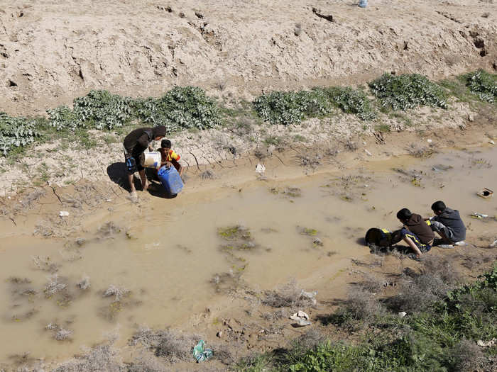 In other parts of Baghdad, people collect their water from swamps due to the overuse of the water in the Euphrates River.