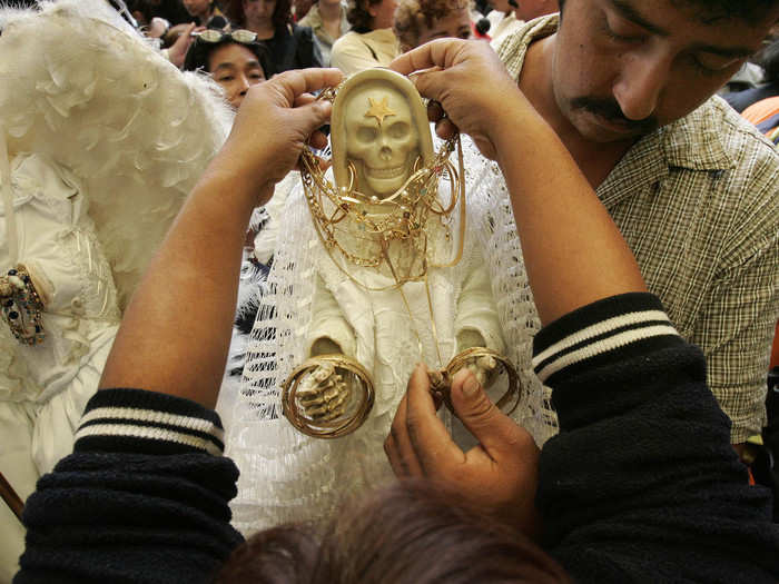 "While narcos pray to Santa Muerte for help in annihilating their enemies or making sure their cocaine shipments safely get to places like Chicago, most people plead for help in love, money, health and other non-criminal things," writes Thomet.