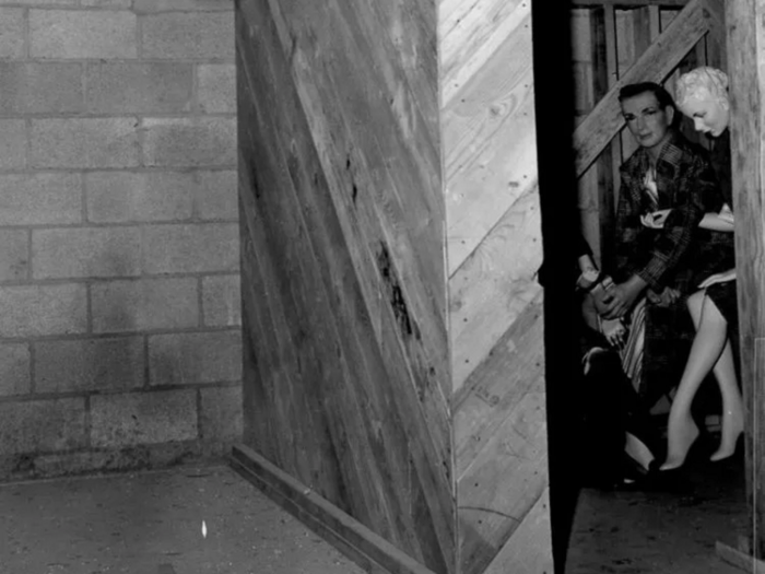 Others family m were in more secure structures, like this group in a wooden structure of a basement.