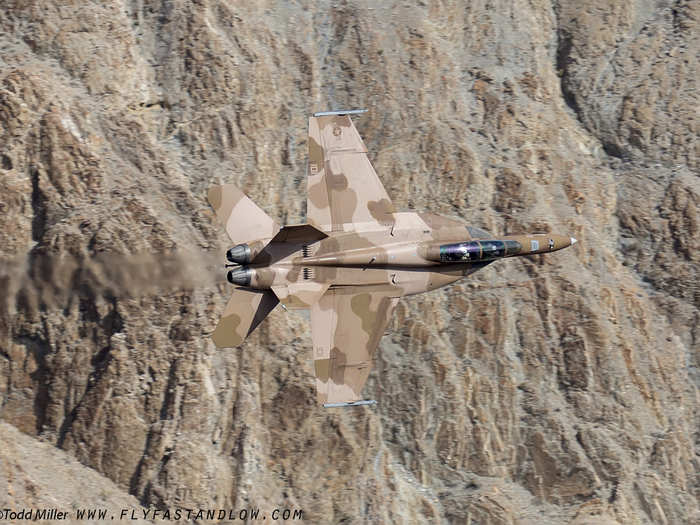 An F/A-18 belonging to the VFA-122 “Flying Eagles” based out of NAS Lemoore and flown by the Fleet Replacement Squadron (FRS) blends seamlessly into the desert background.